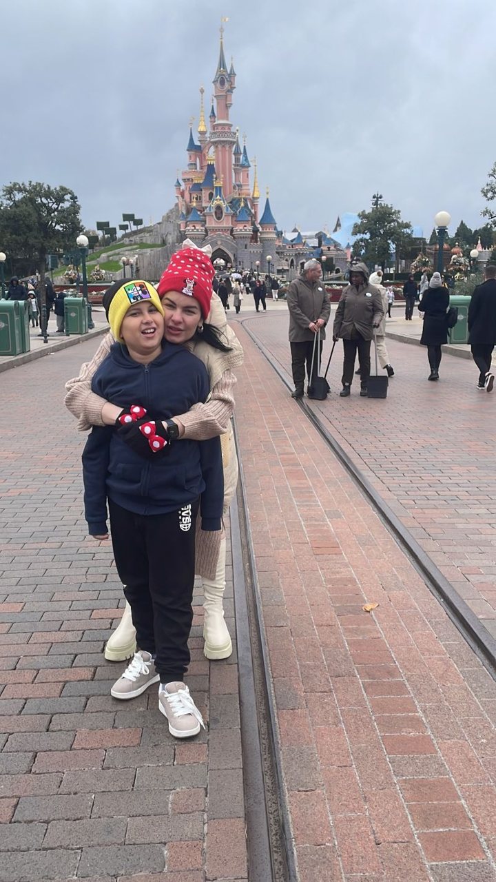 Lucca and his mum in front of Sleeping Beauty Castle at Disneyland Paris