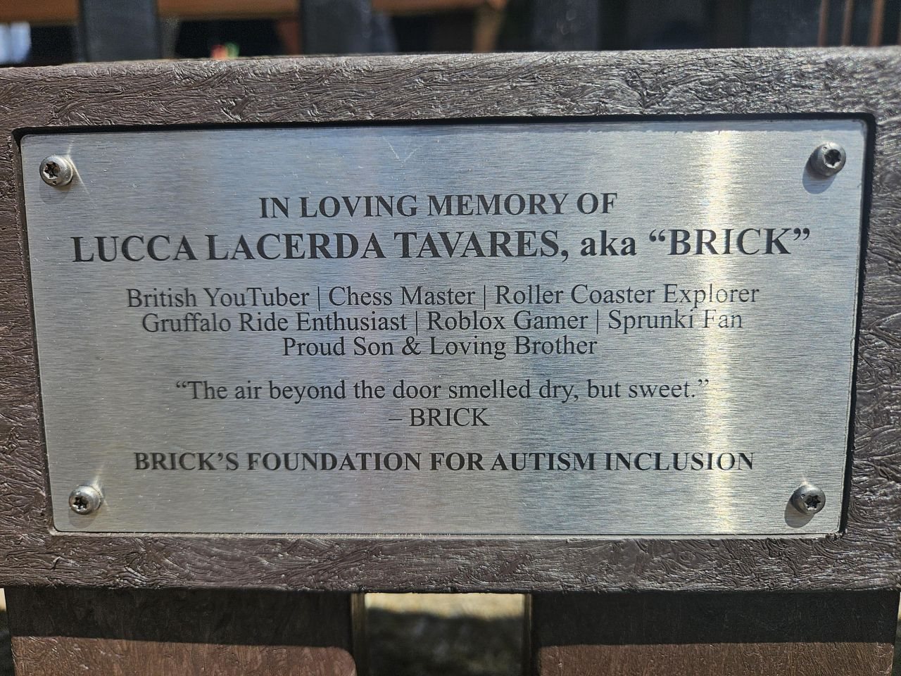 The plaque on Lucca's bench at Chessington